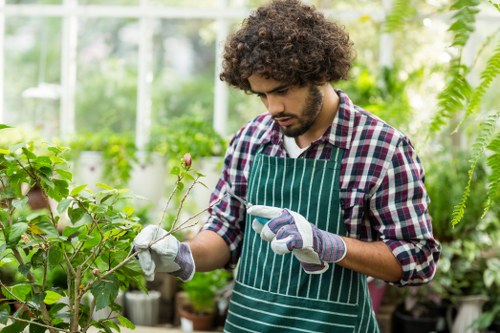 Worker handling green waste and environmental controls
